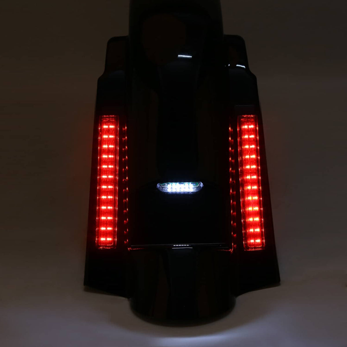 Rear LED fender with illuminated red vertical bars and center blue marker light