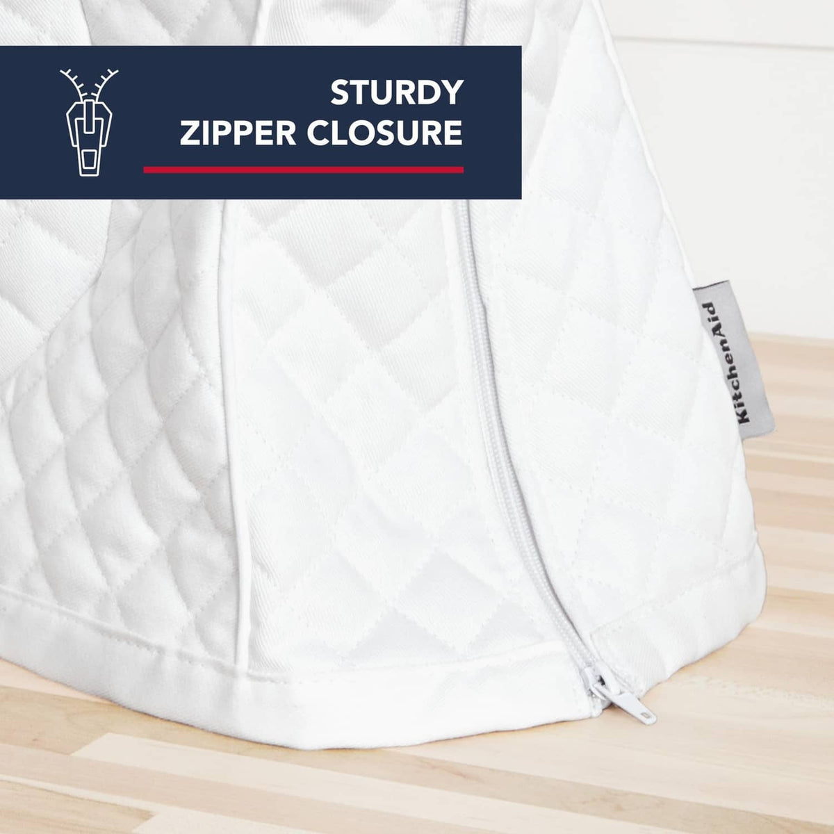 White quilted stand mixer cover with visible zipper closure