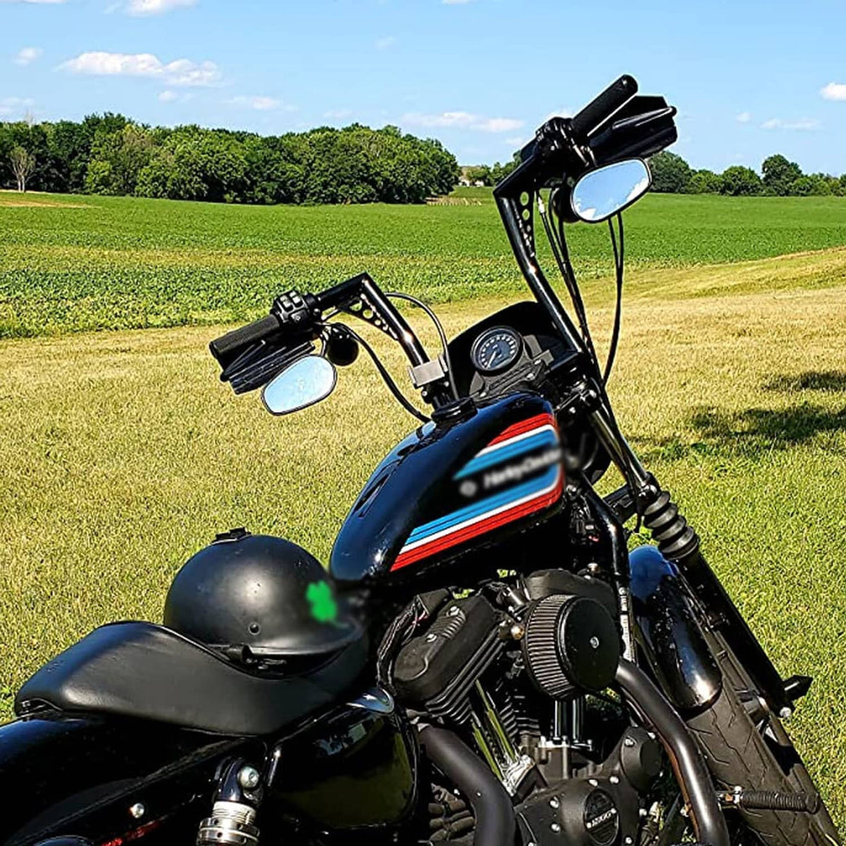 Black 12-inch rise motorcycle handlebars installed on front of bike