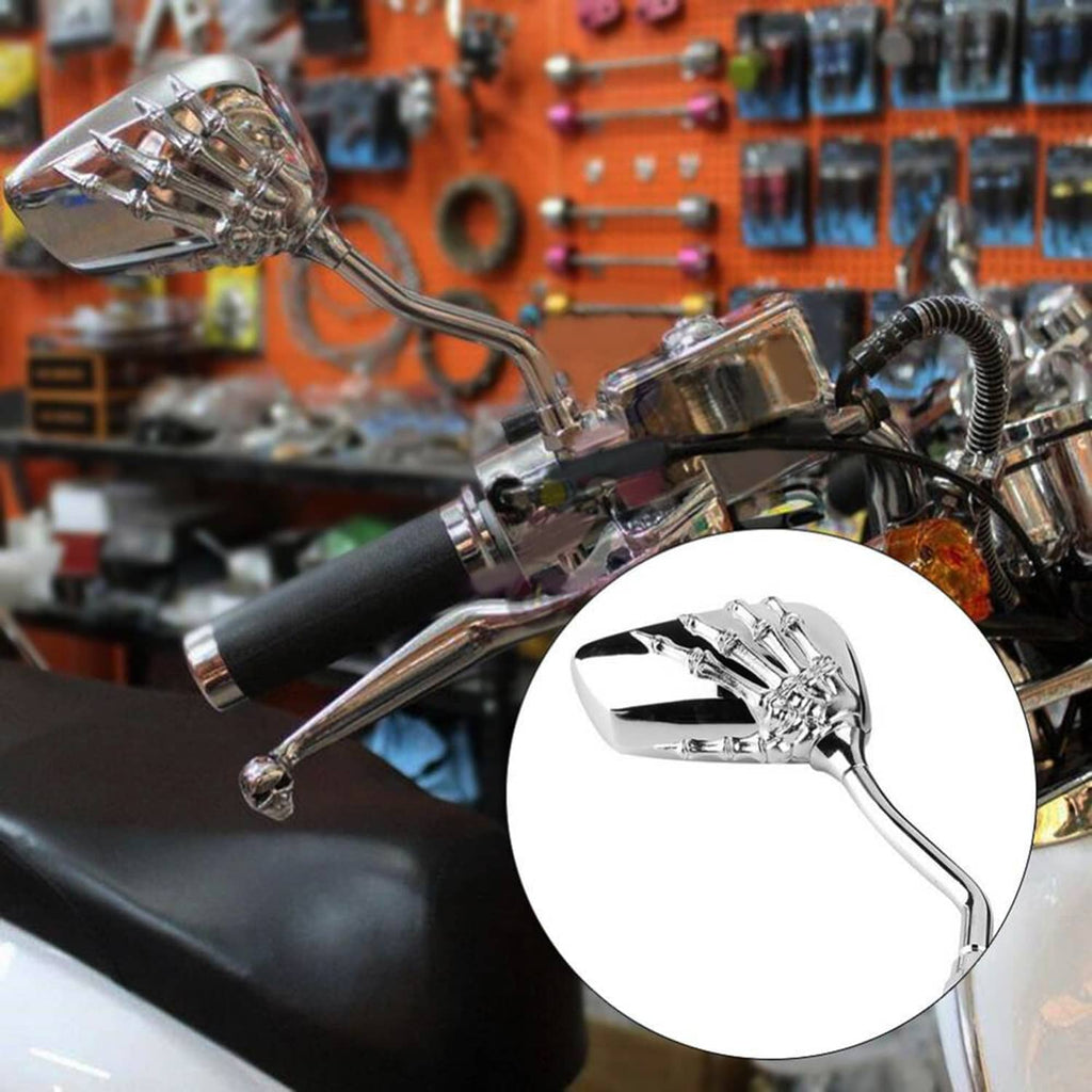 Mounted chrome rearview mirror with skull hand engraving and blue-tinted glass