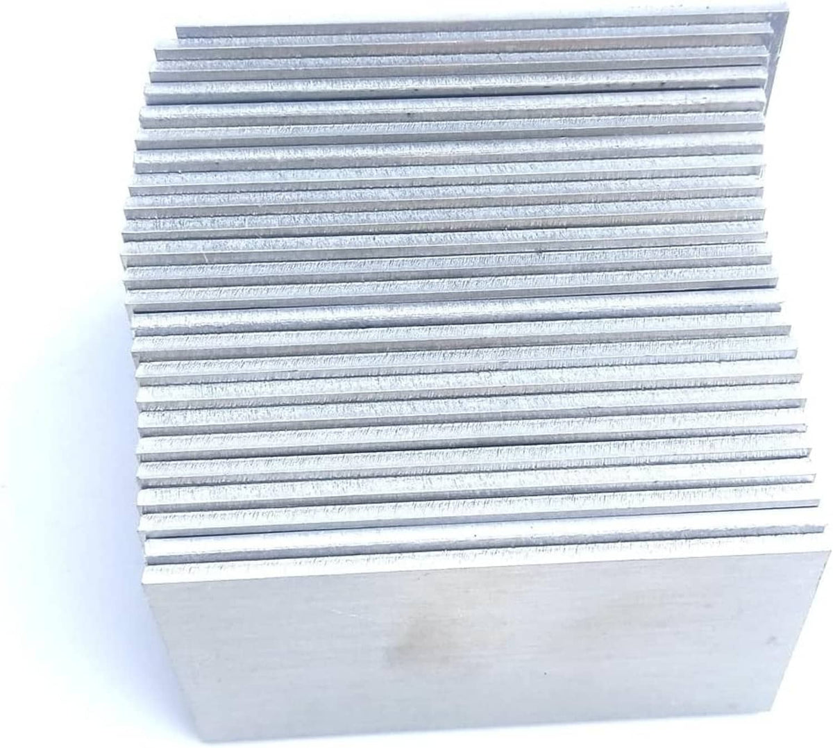 Rectangular aluminum coupon sheets stacked, showing repeating horizontal metal edges.