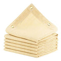 Beige sun shade cloth panels with reinforced grommets, folded stack