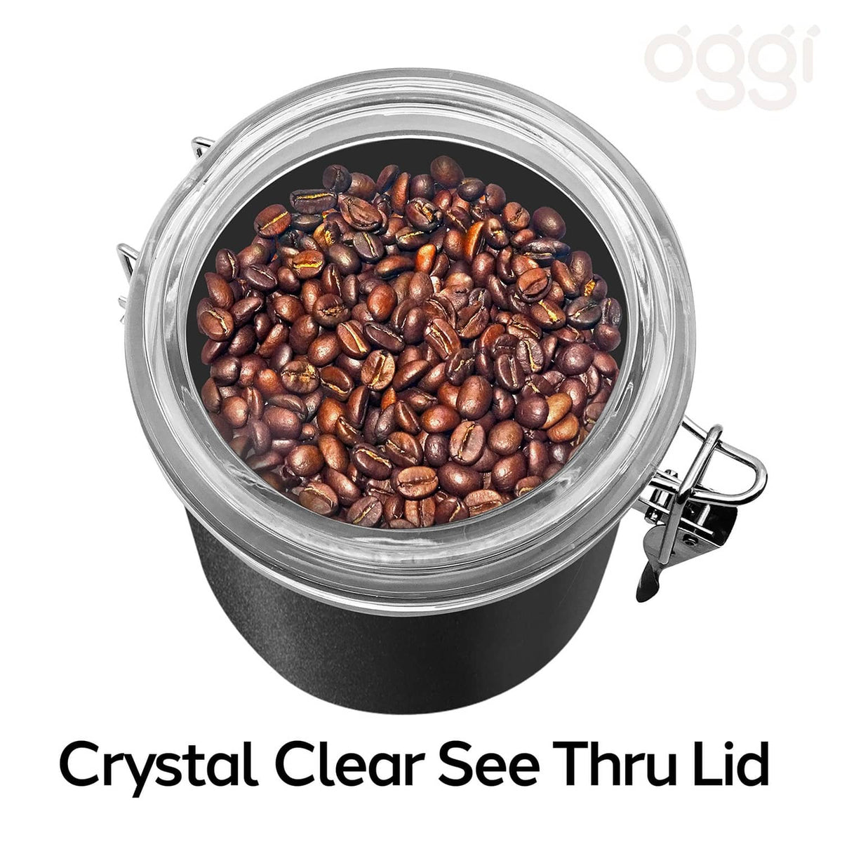Black stainless steel airtight container with clear see-through lid holding coffee beans