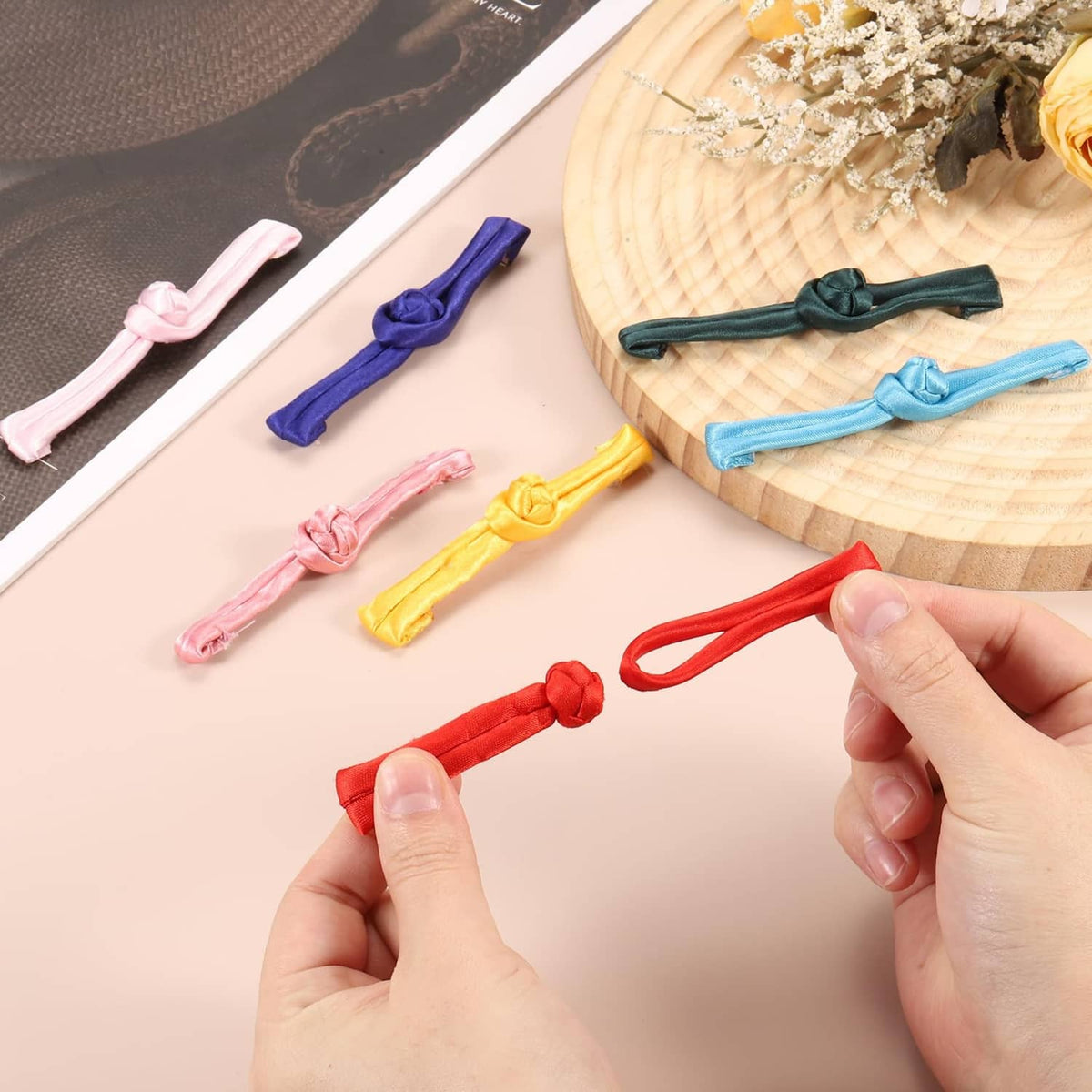 Frog button closures in mixed colors, including dark green knot-style pieces