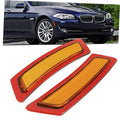 Amber front bumper side marker lights with red housing and rectangular reflectors