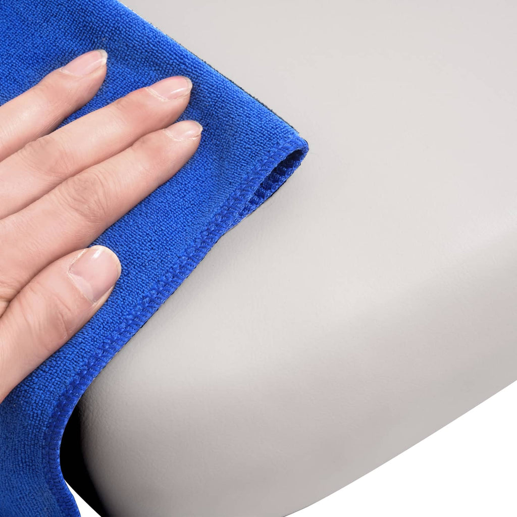 White seat cushion cover edge with blue cleaning cloth and textured fabric