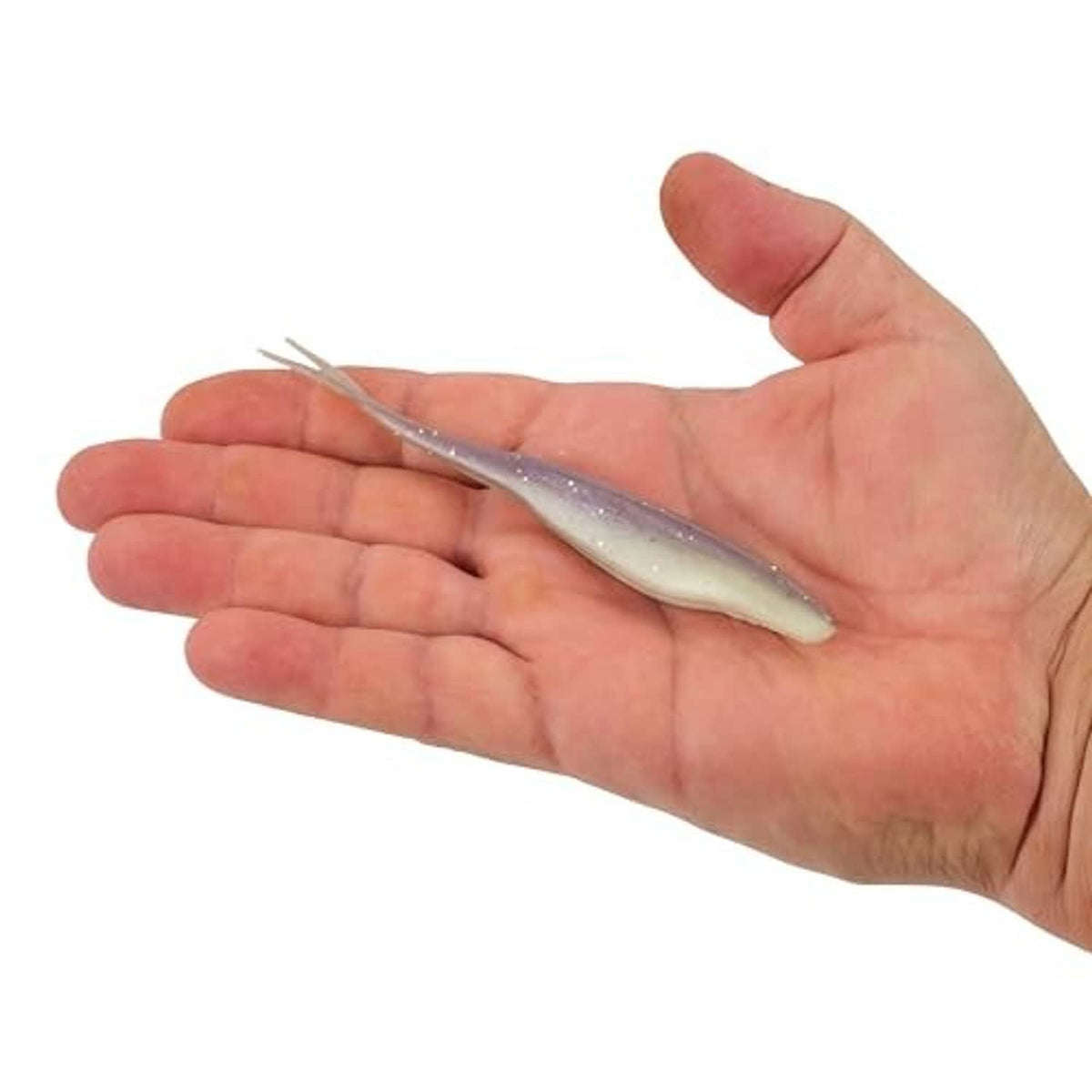 Hand holding a purple-and-white speckled soft plastic jerk bait