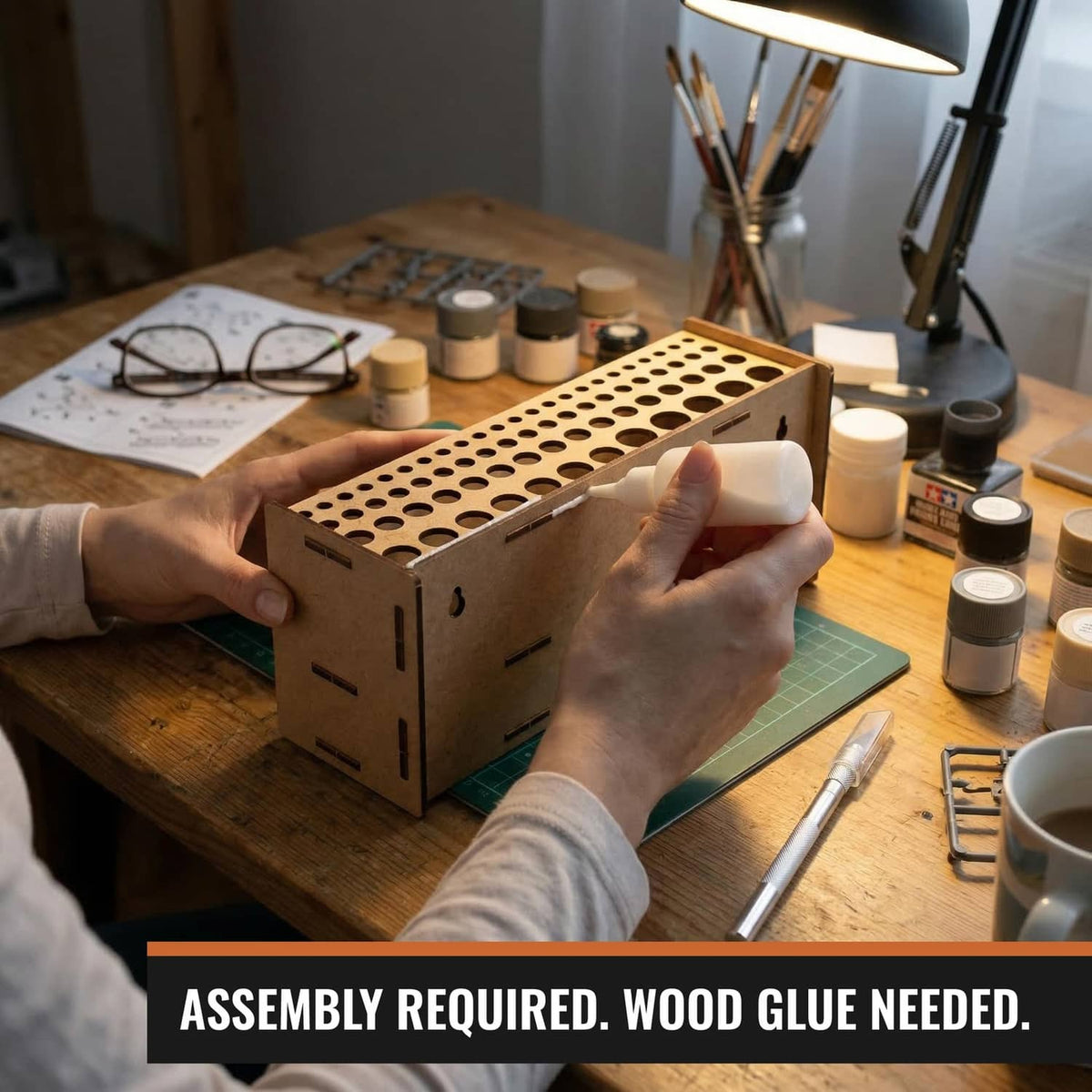 Wooden brush organizer with predrilled holes being assembled on a workbench