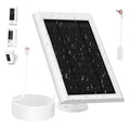 White solar panel charger with black photovoltaic cells, base stand, and charging cable coil