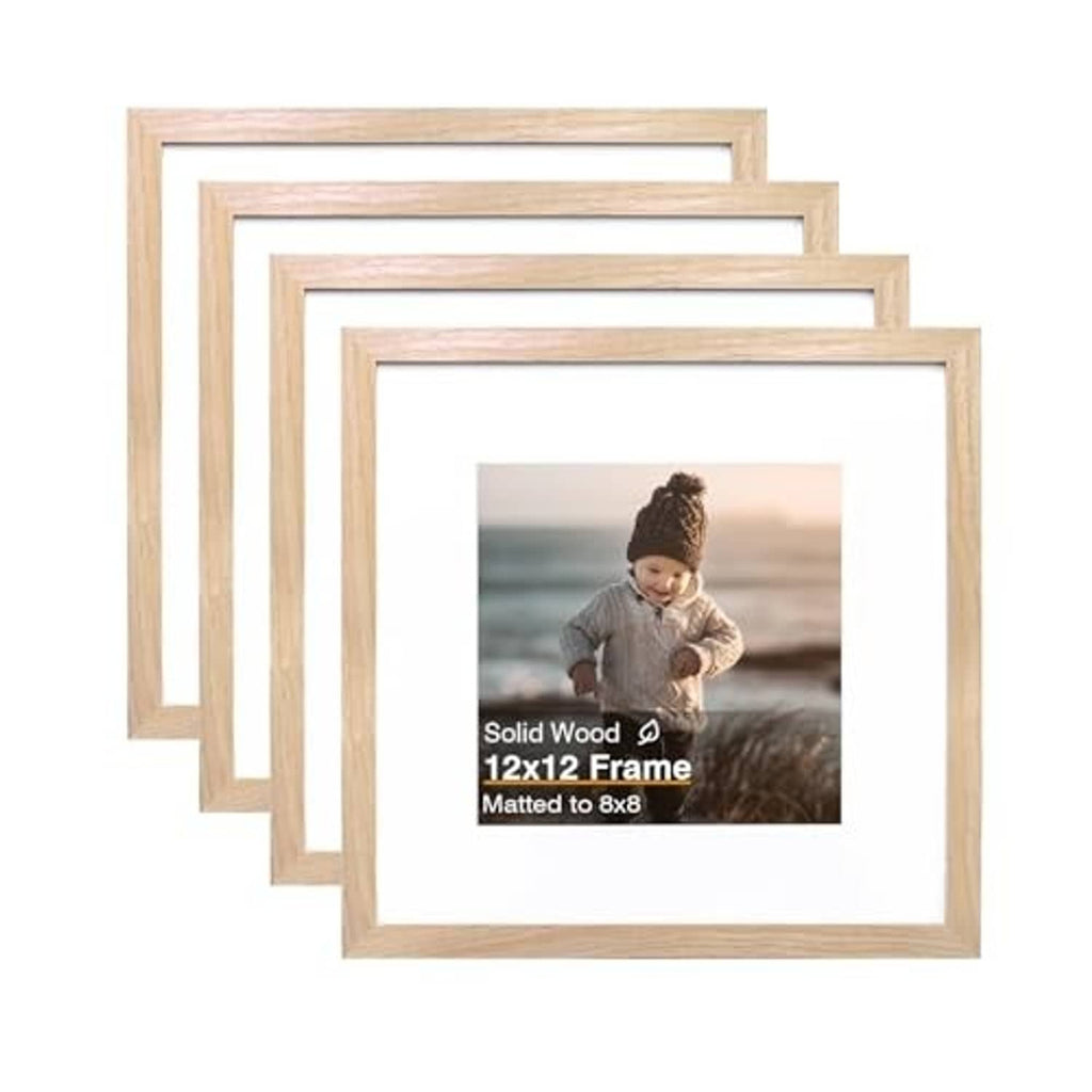 Four natural wood square picture frames, front view stacked with light mat opening