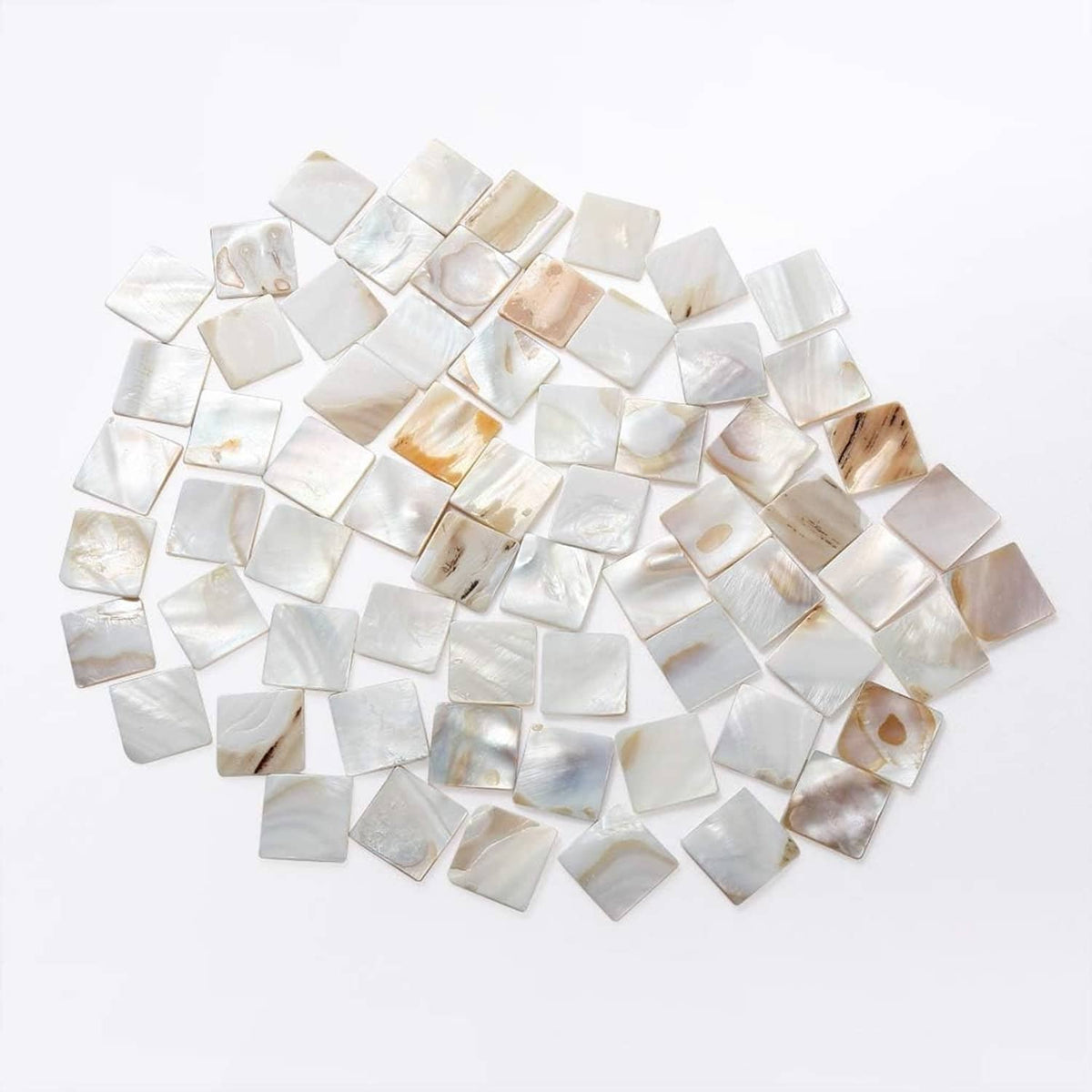 Mother-of-pearl mosaic tile pieces in white and light iridescent shades