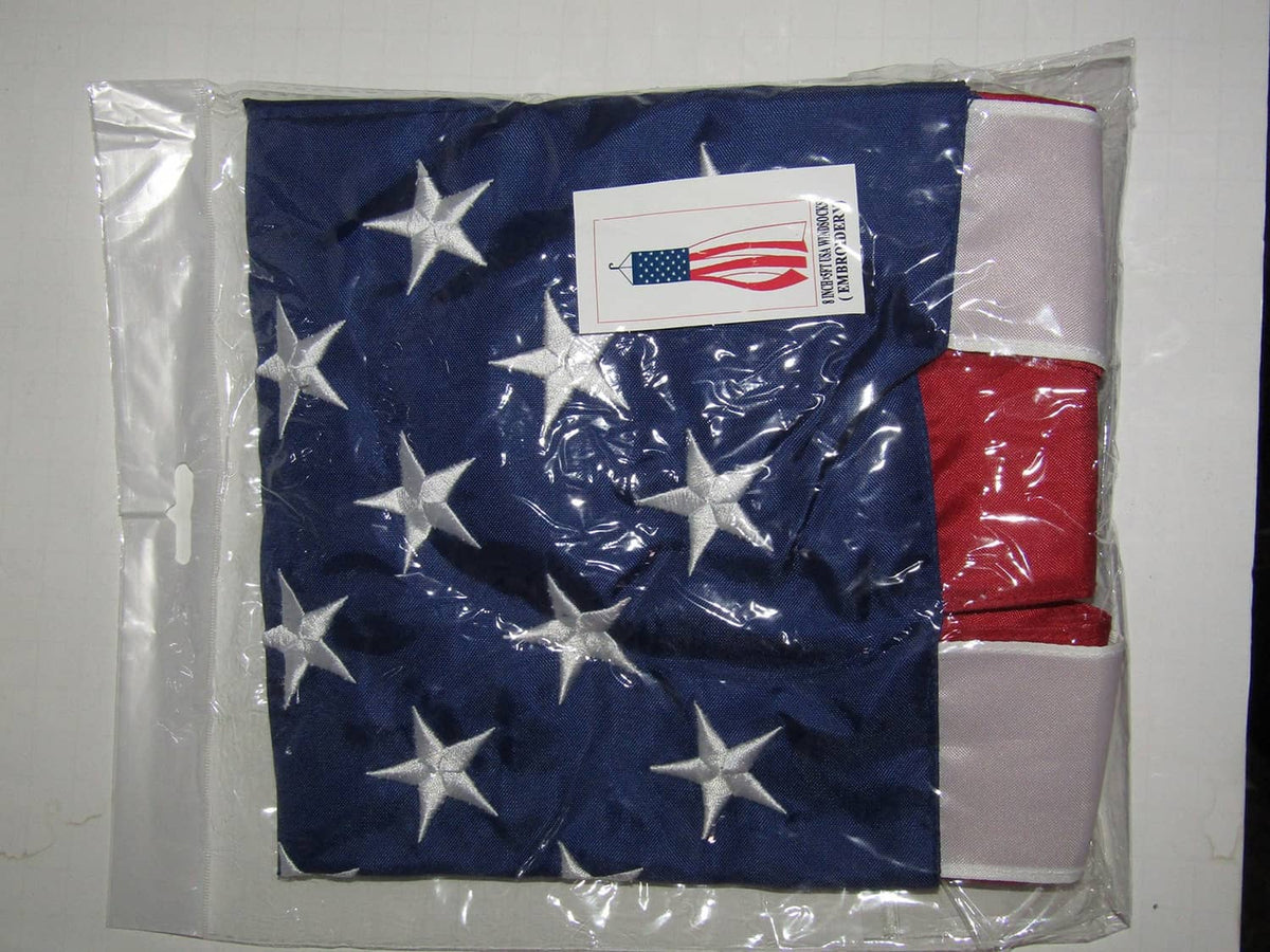 Navy embroidered stars windsock with red panel and white detailing, shown in package