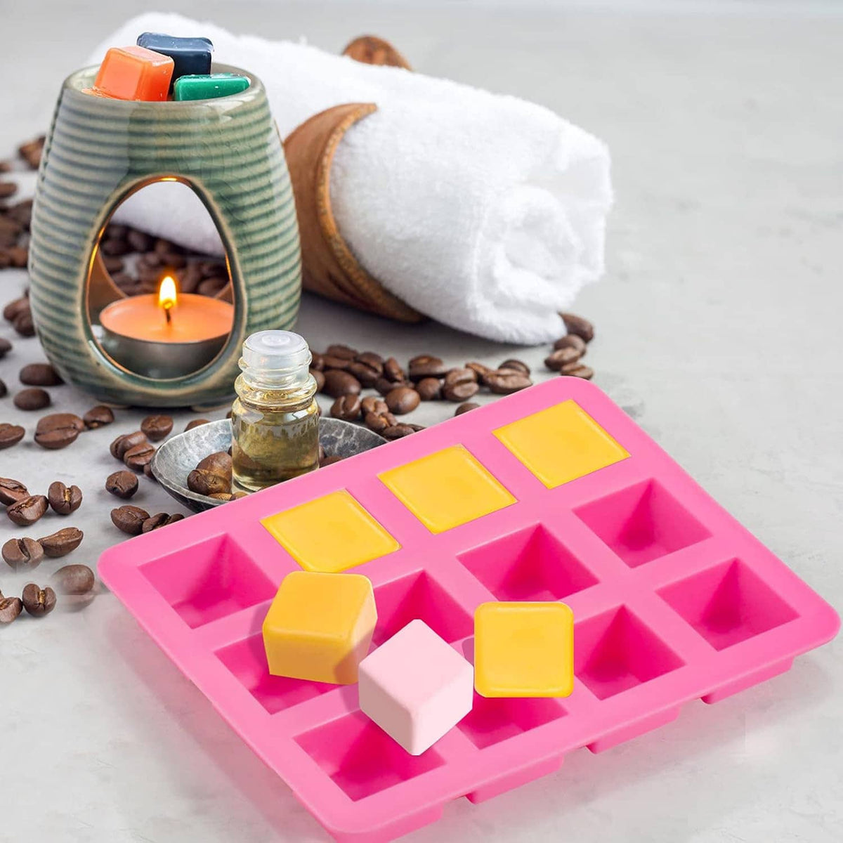 Silicone wax melts mold set with pink square mold and yellow and pink wax cubes