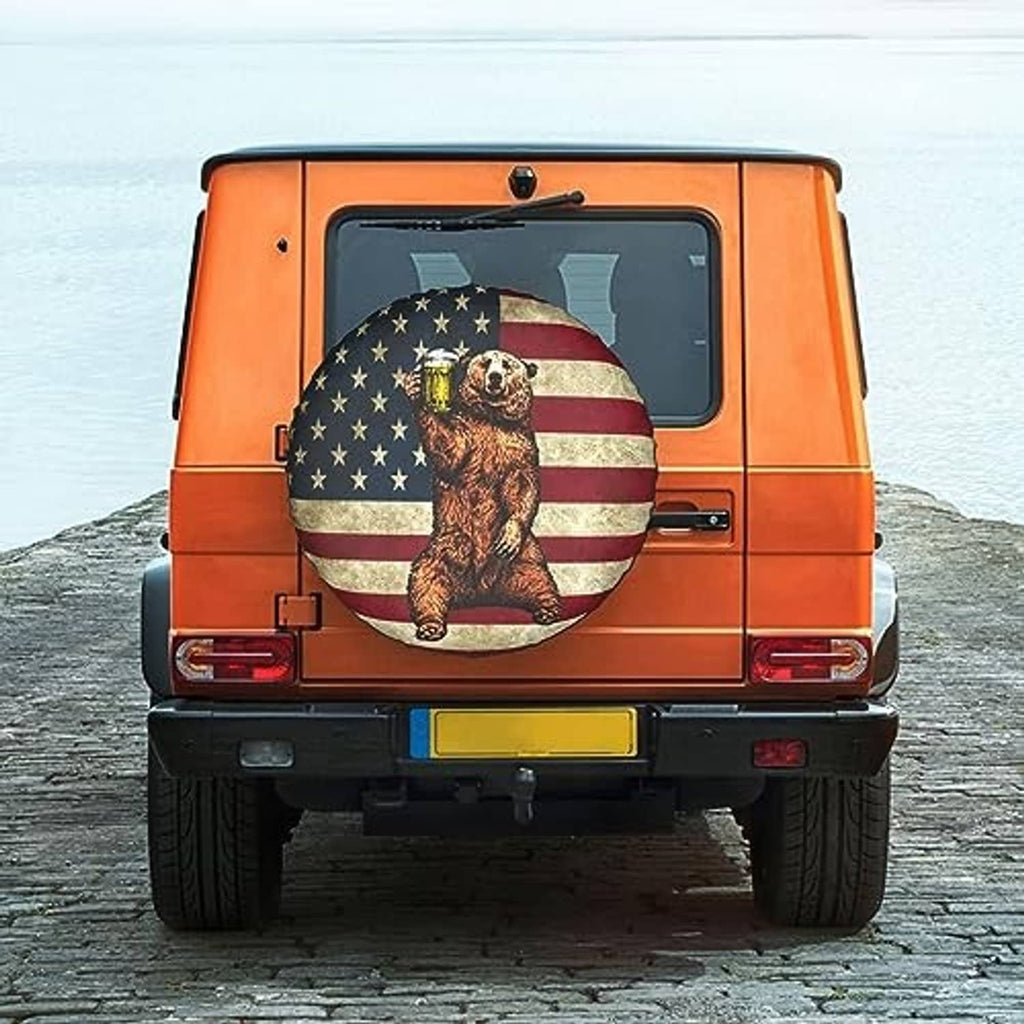 RV spare tire cover with bear and American flag design on a round black cover