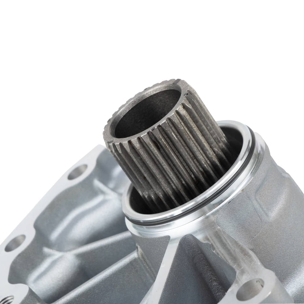 Transfer case assembly close-up of ribbed output shaft on silver housing