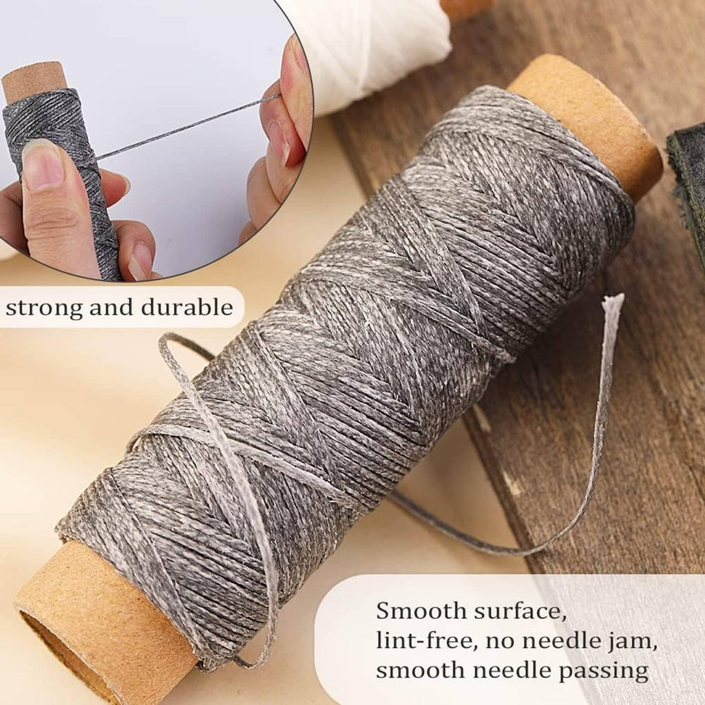 Waxed leather sewing thread on spool with needle passing through the thread