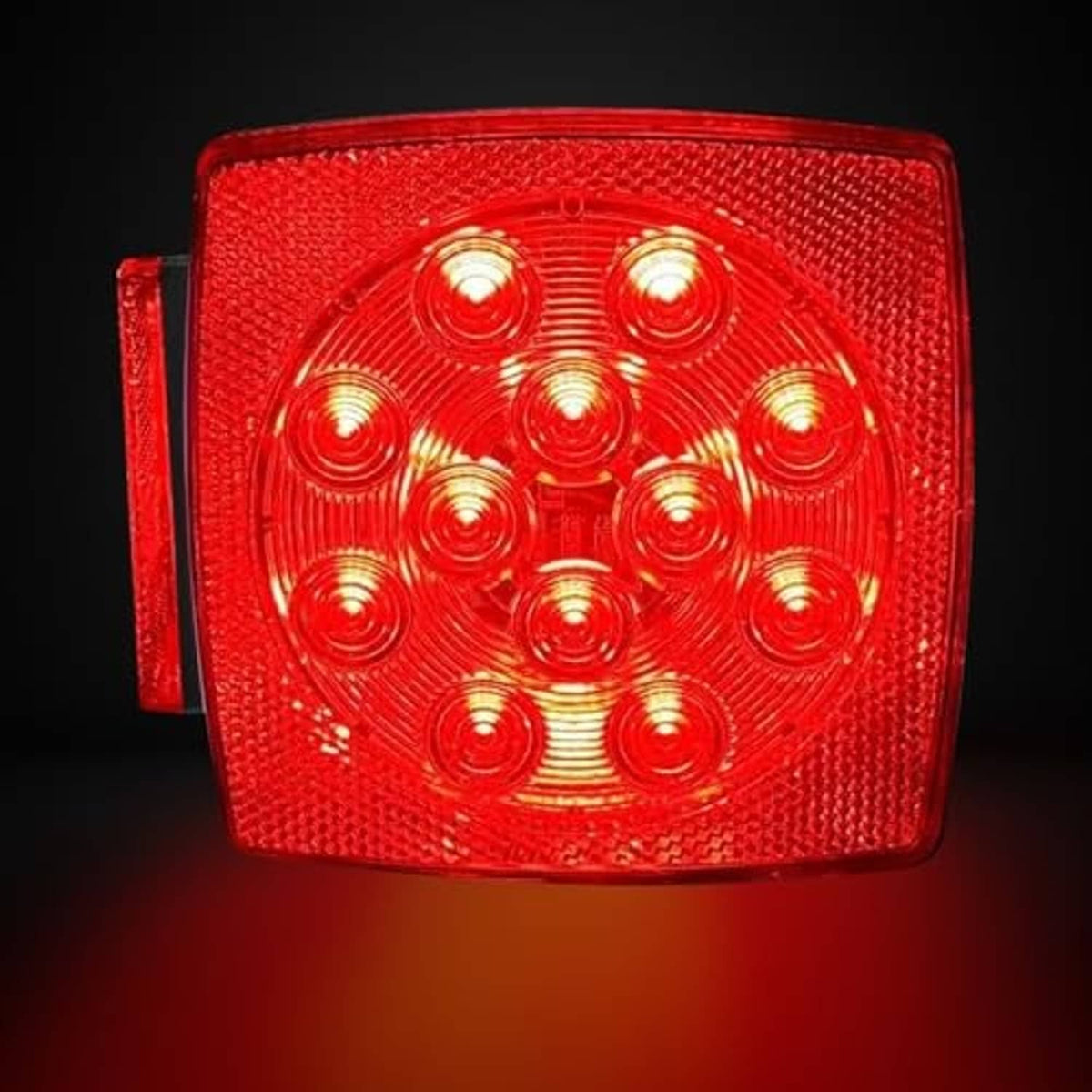 Illuminated red LED square tail marker light with circular lens design