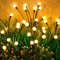 Outdoor solar garden lights set with multiple glowing round bulbs on black stakes