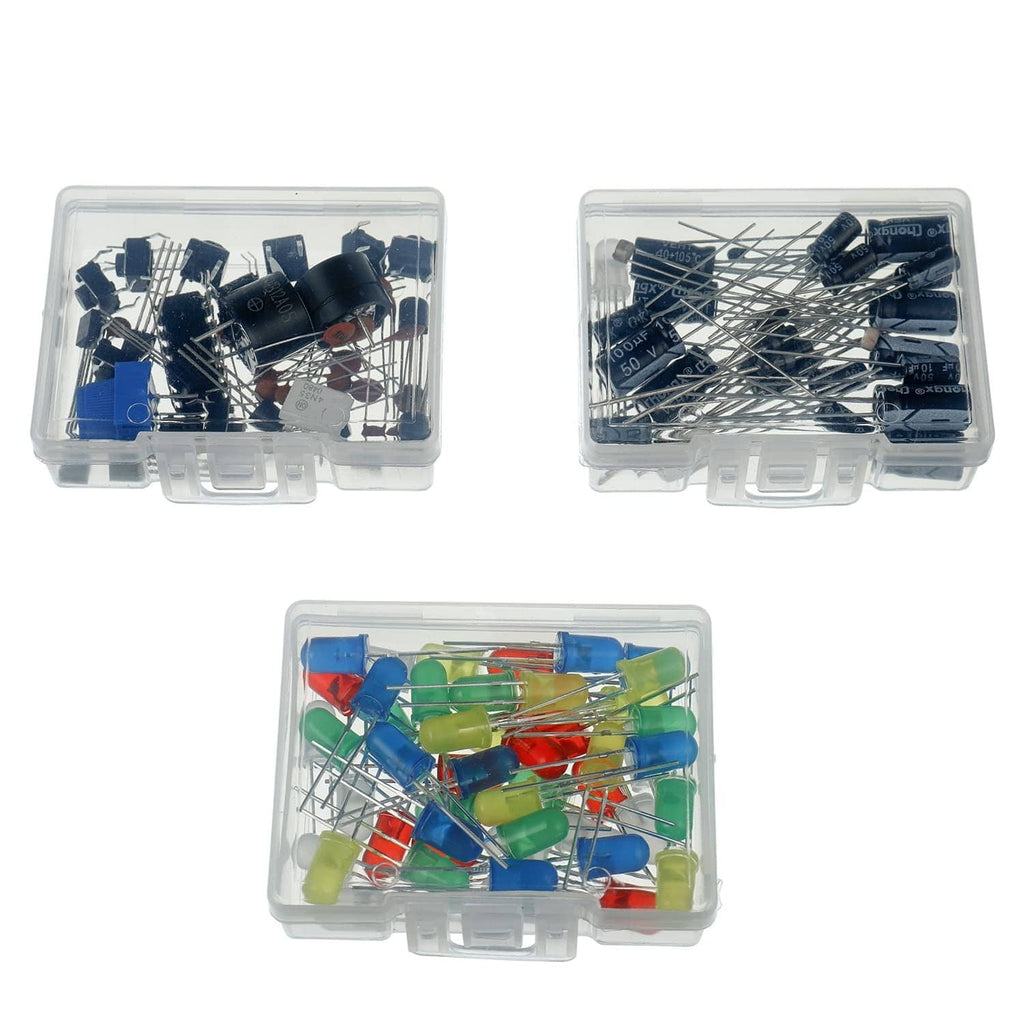 Assorted electronic components in clear organizer boxes, including capacitors and resistors
