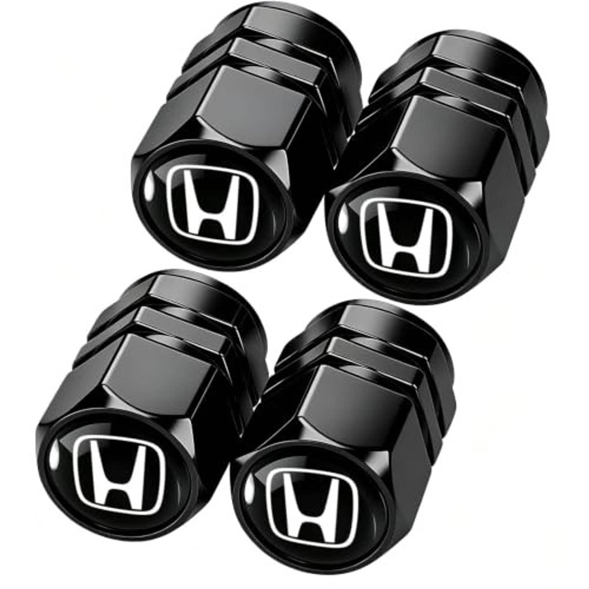 Four black metal tire valve stem caps with Honda logo, faceted hex shape