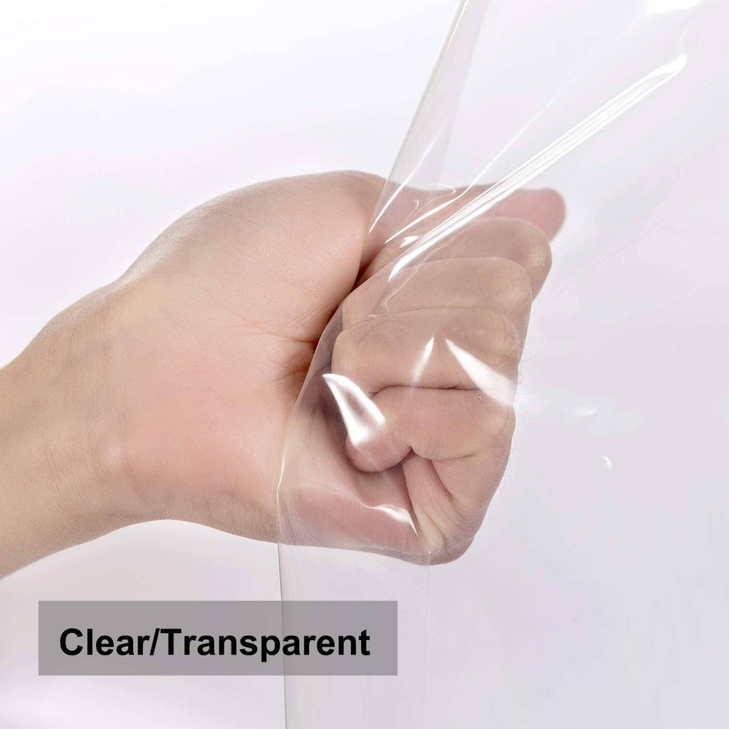 Transparent clear shower liner fabric pinched in hand to show flexible plastic sheet