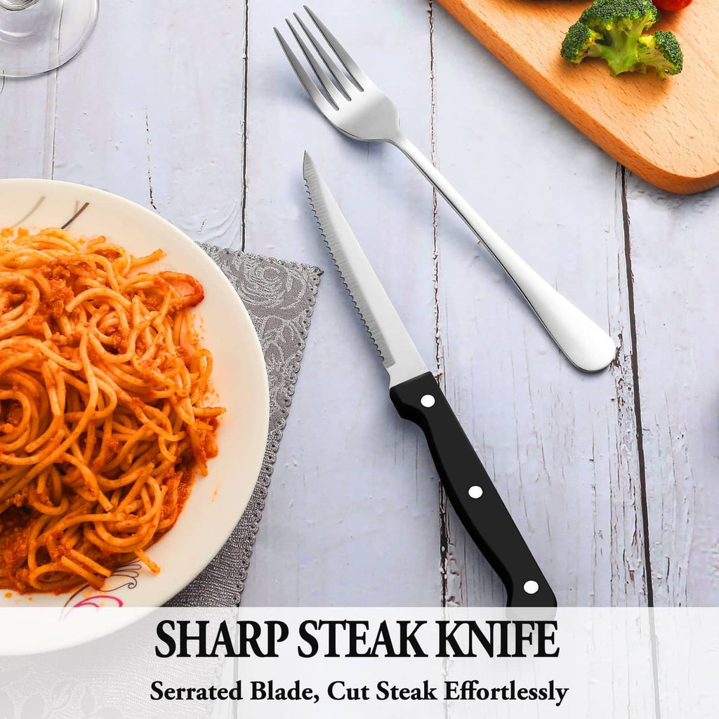 Stainless steel steak knife with serrated blade and black handle, with fork and spoon
