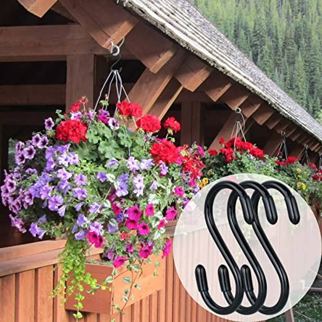 Black S hooks on outdoor beam, hanging flower planters in a row.
