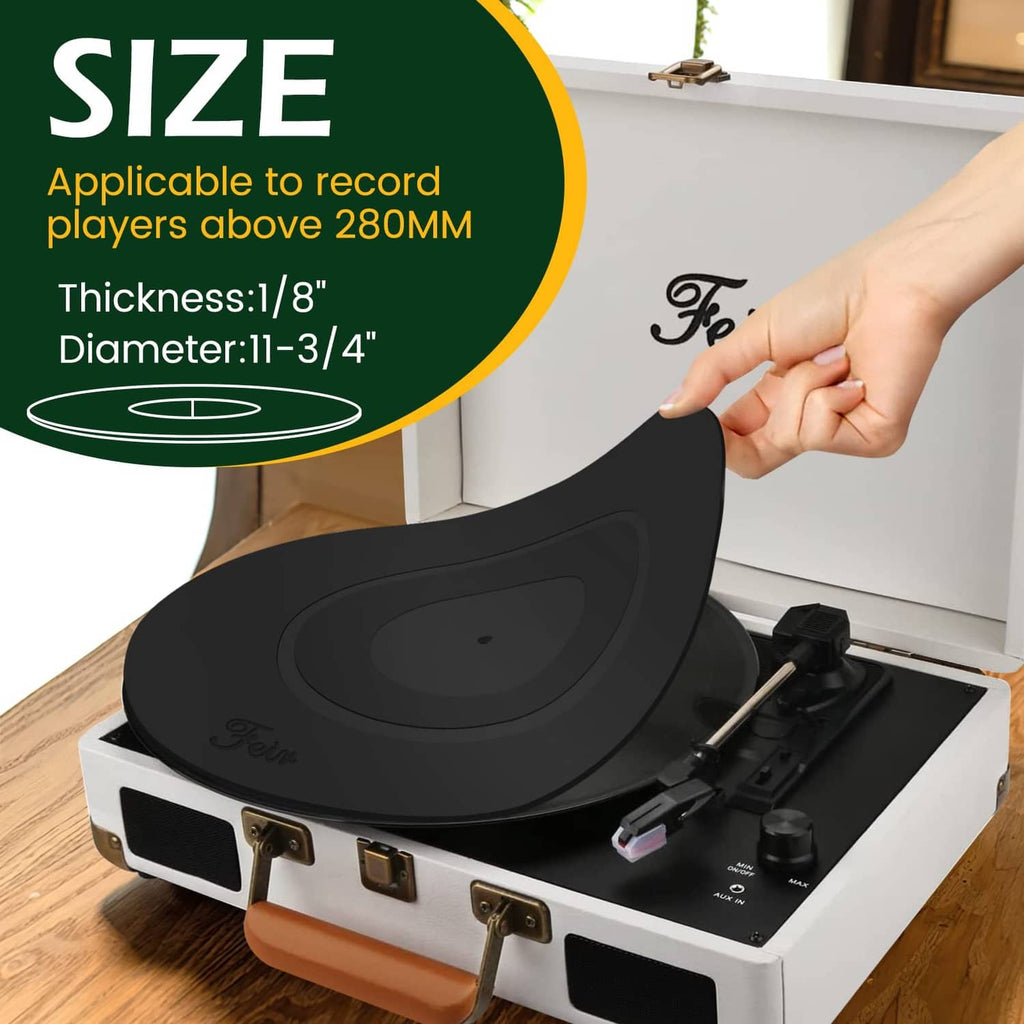 Black platter mat partially lifted from turntable, showing center and ring grooves