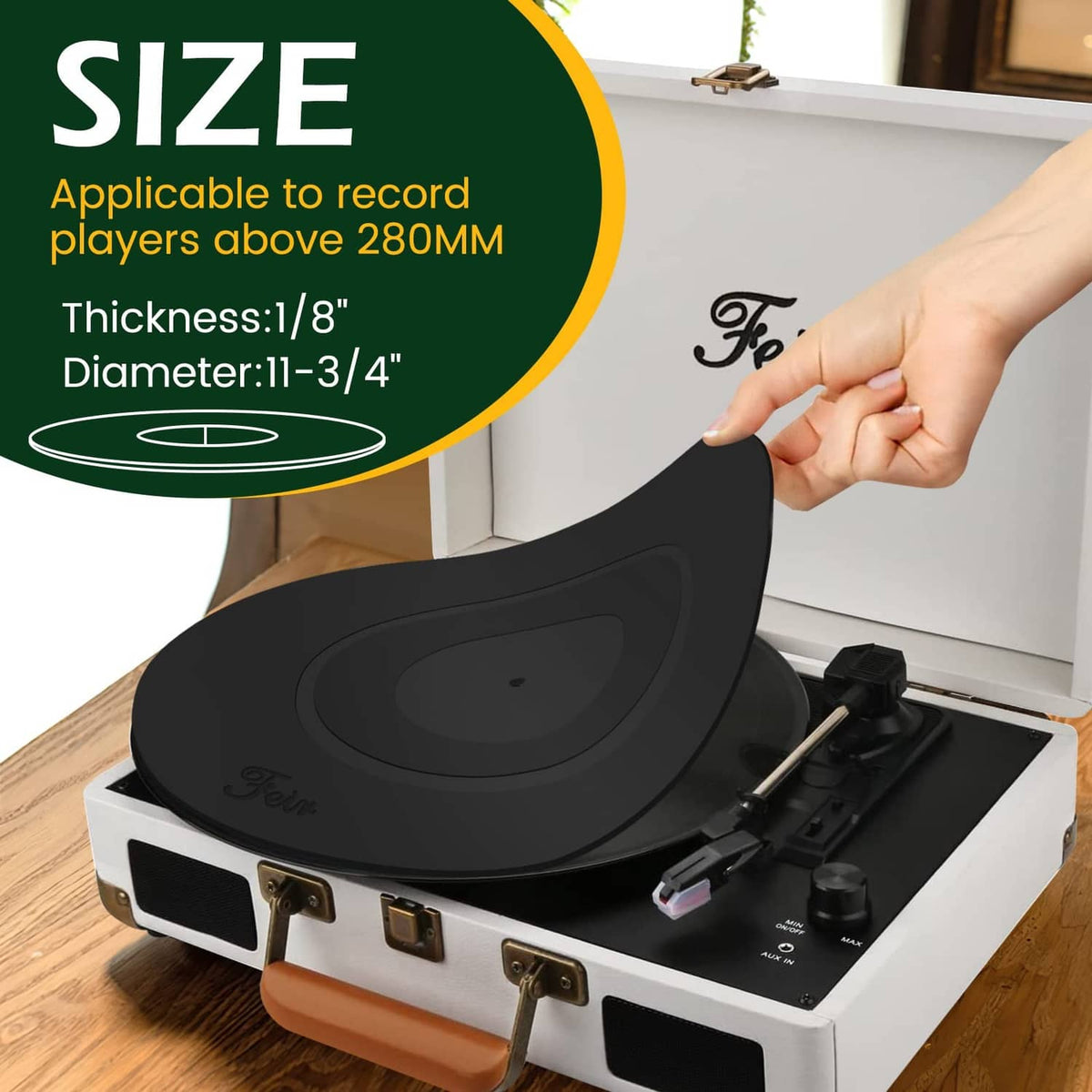 Black platter mat partially lifted from turntable, showing center and ring grooves