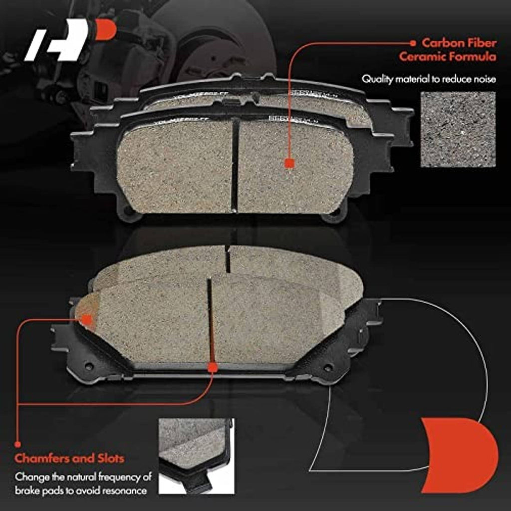 Close-up brake pads with gray ceramic friction surfaces and layered backing plates