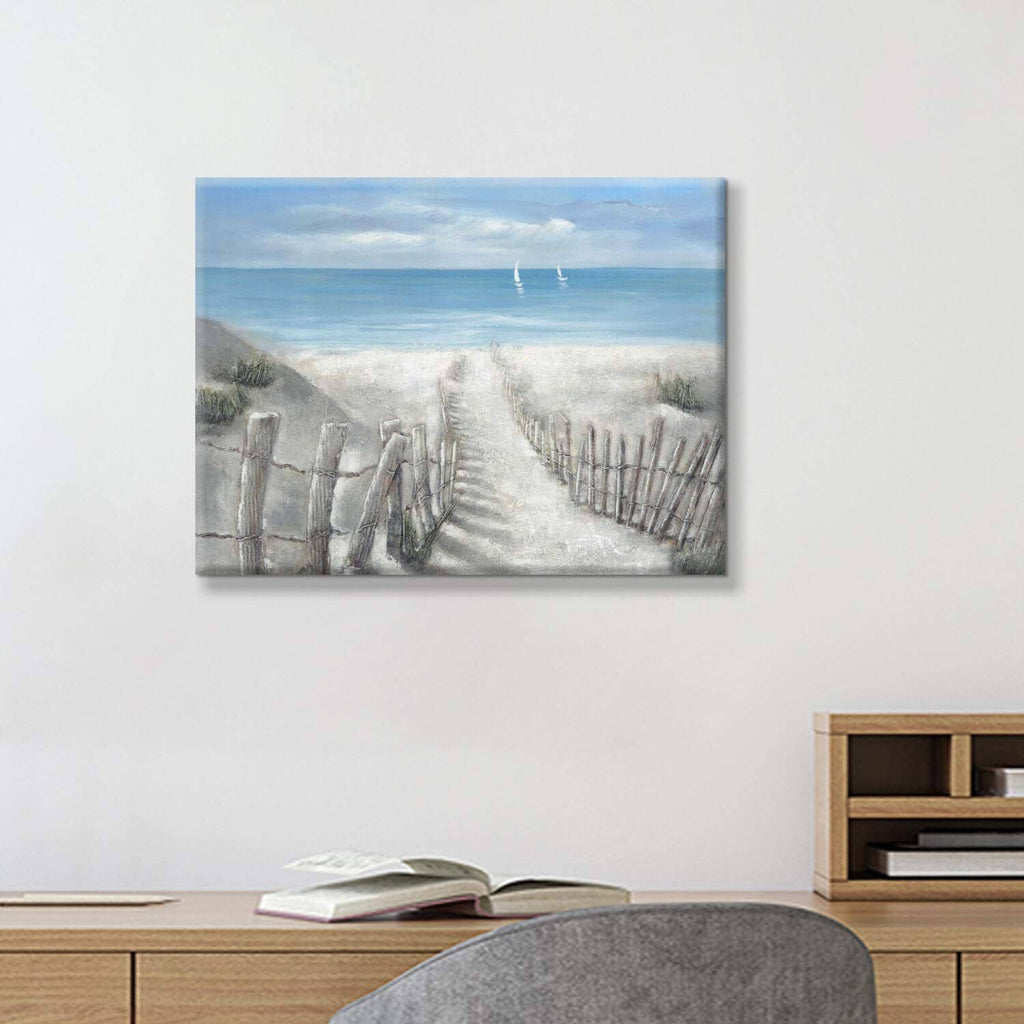 Coastal ocean canvas wall art with sandy walkway, fence posts, and sailboats