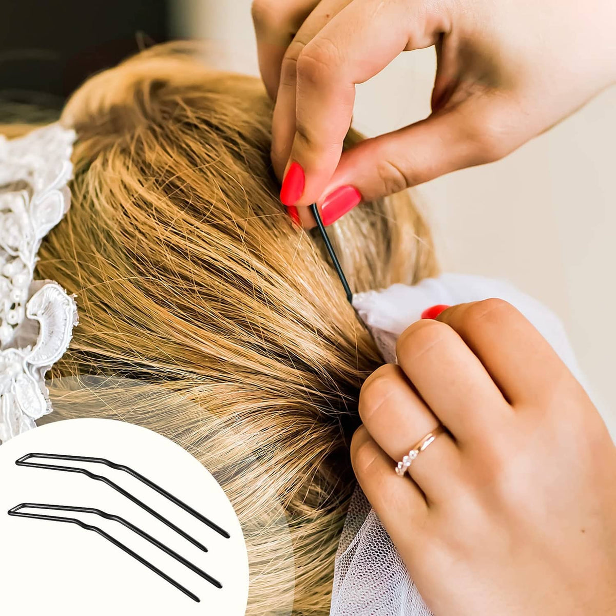 Black U-shaped hairpin securing a bun hairstyle, close-up of pin placement