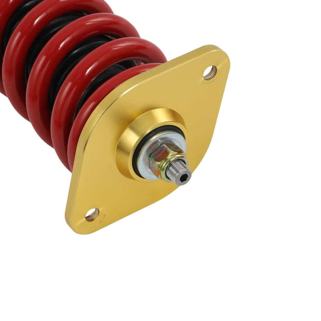 Gold top mounting plate with central bolt and red coil spring