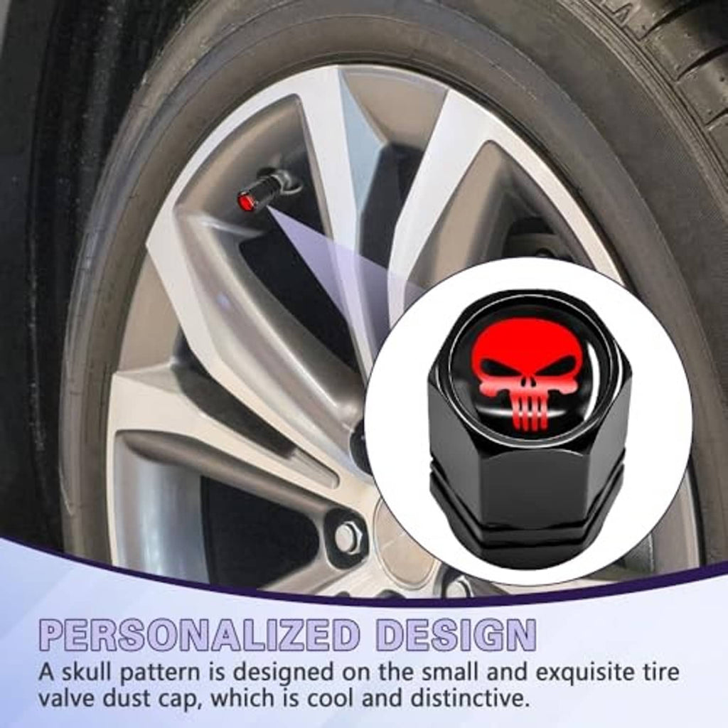 Black tire valve stem cap with red skull emblem fitted on a wheel rim.