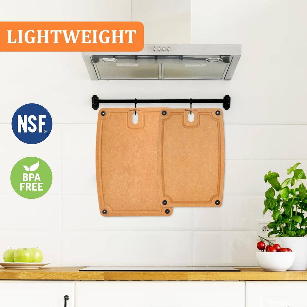 Tan composite cutting board set displayed on a kitchen counter, showing two boards
