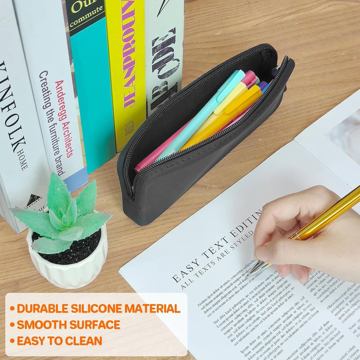 Black silicone pencil case with zipper, holding colorful pens and pencils