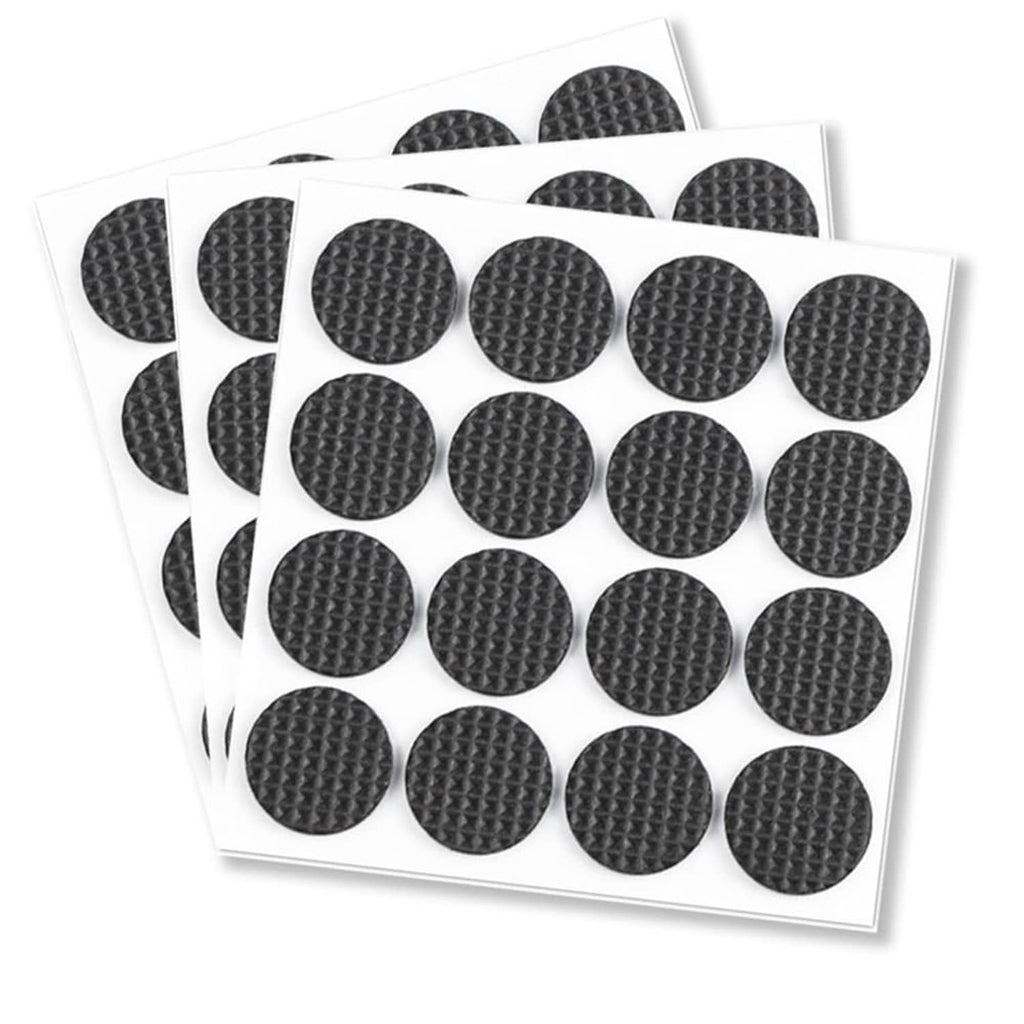 Round black felt furniture pads on backing sheets, textured non-slip surface