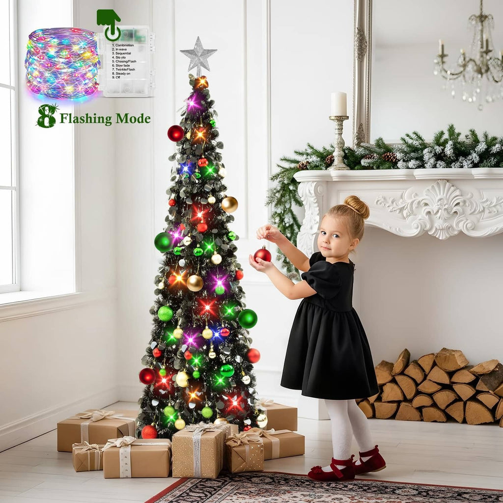 Black tinsel 5ft Christmas tree with star topper, multicolor flashing LED lights, and balls