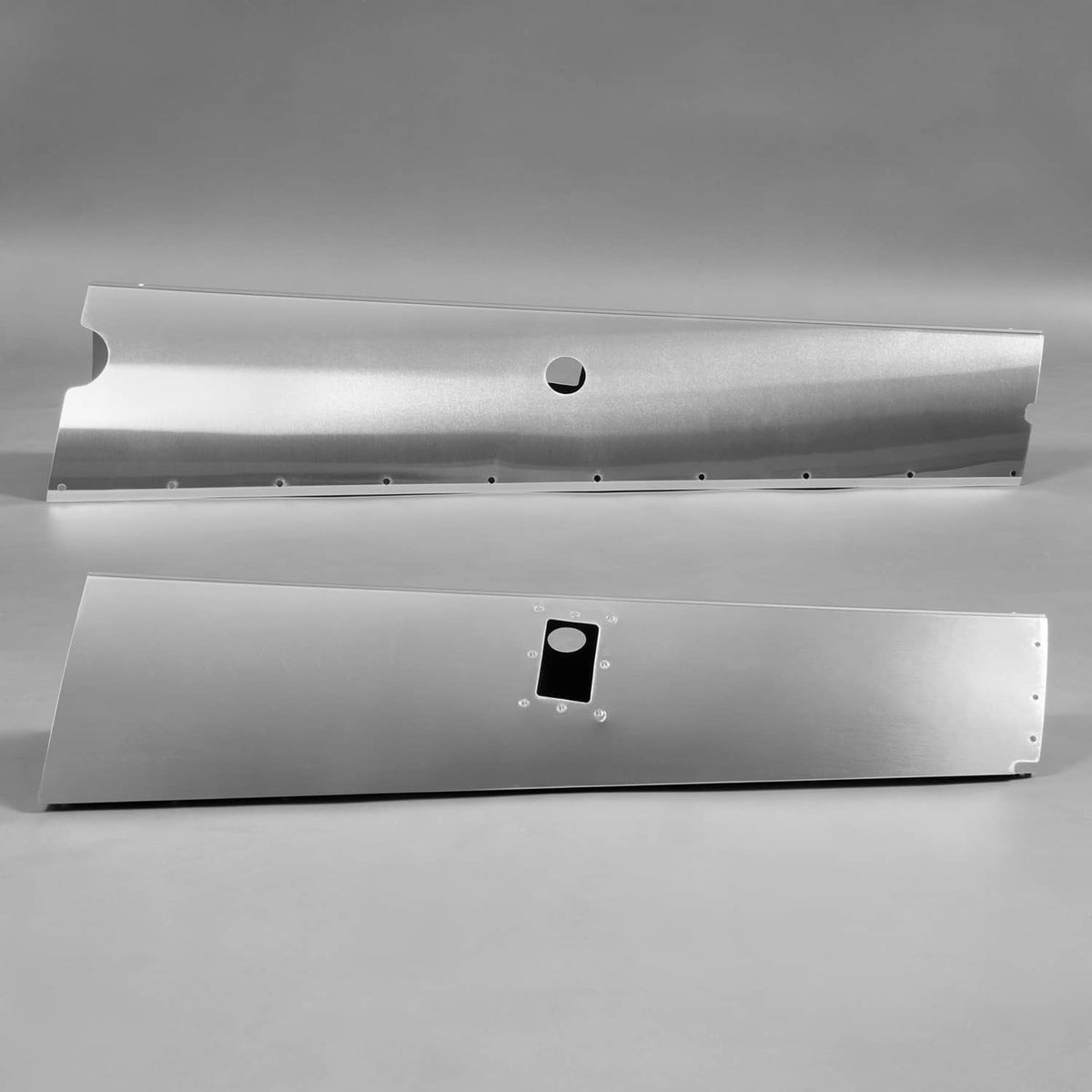 Silvery aluminum landing gear fairing panels, paired top views with square access plate