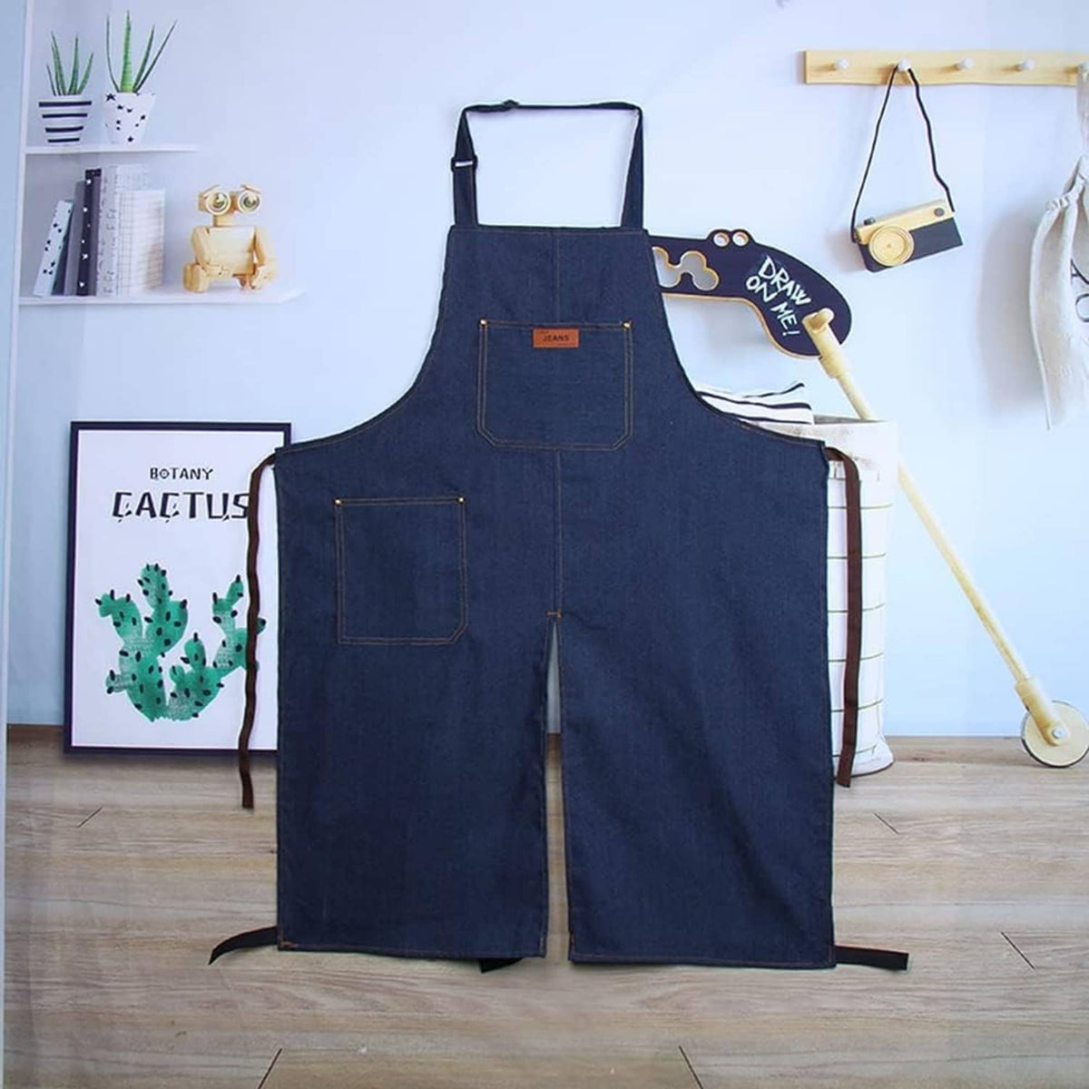 Blue denim split-leg pottery apron with bib pocket and wide adjustable straps