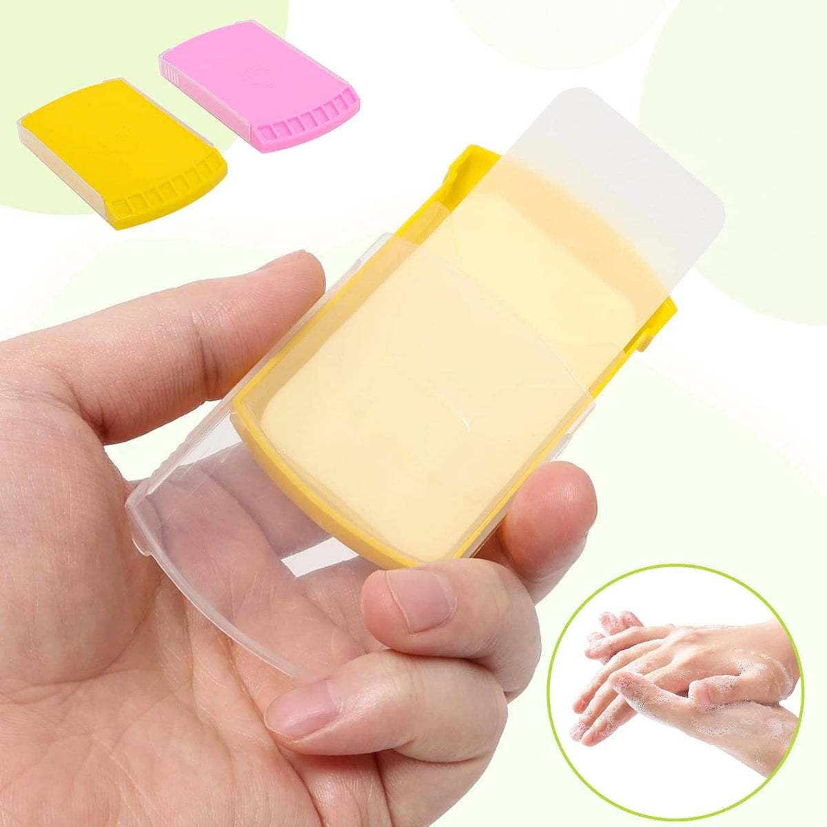 Hand washing soap sheet in clear wrapper, held above a yellow folding case