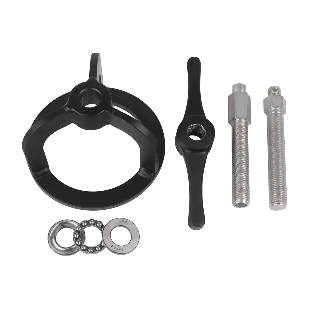Black spring compressor tool kit with circular base, handle lever, and included bolts