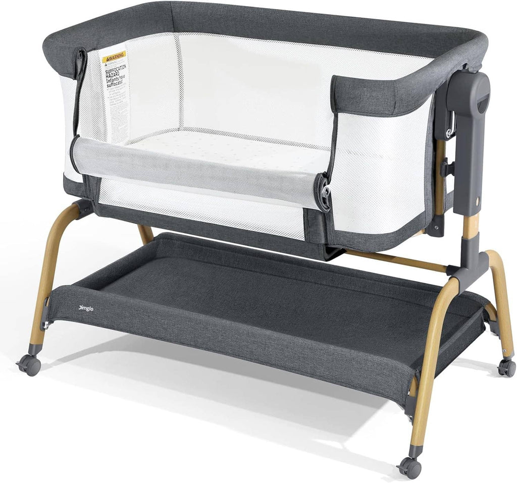 3-in-1 baby bassinet with gray fabric canopy, white mesh sides, rocking base wheels.