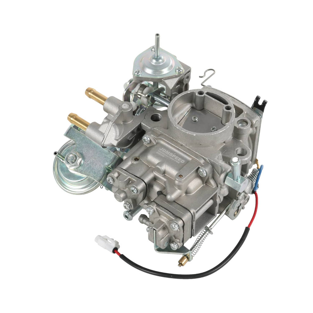 Carburetor assembly with circular intake opening and vacuum lines, silver metal body