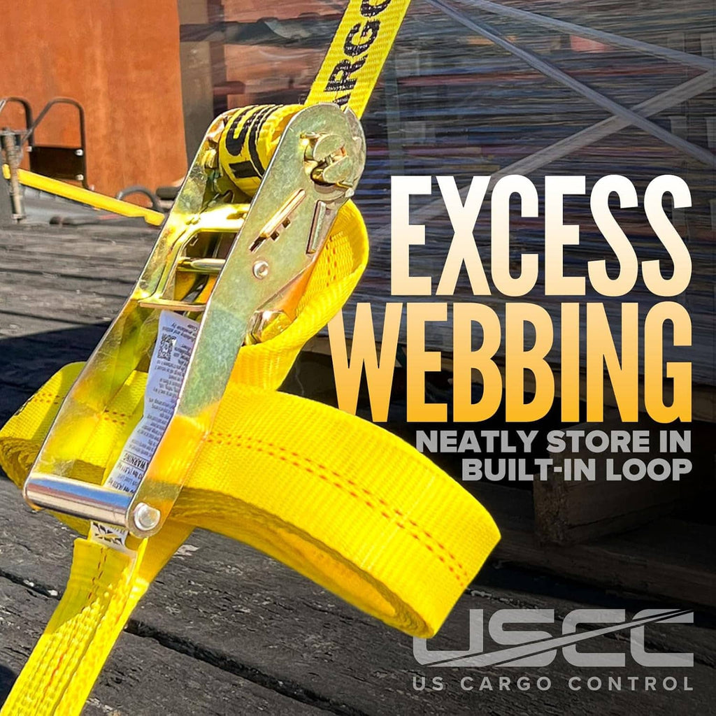 Yellow ratchet strap with wire hook and loop, attached to cargo on flat surface