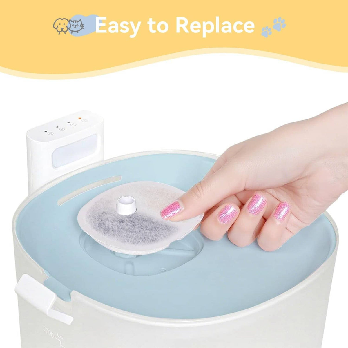 Hand inserting a round replacement filter pad into water fountain reservoir