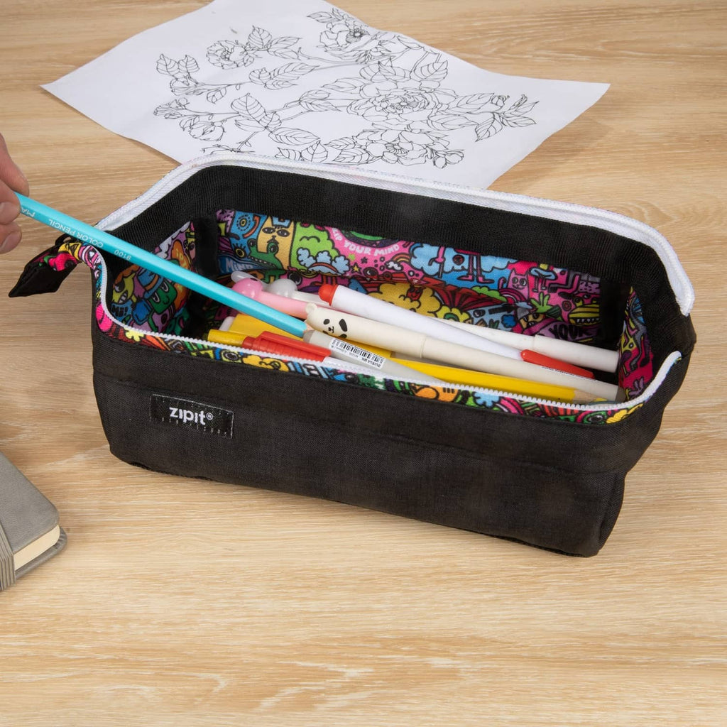 Black ZIPIT pencil case open with colorful doodle lining and pens and markers inside