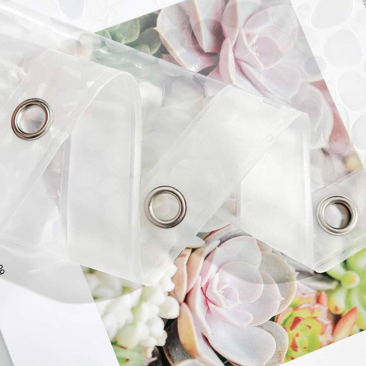 White shower curtain liner fabric with metal grommet rings and floral design detail