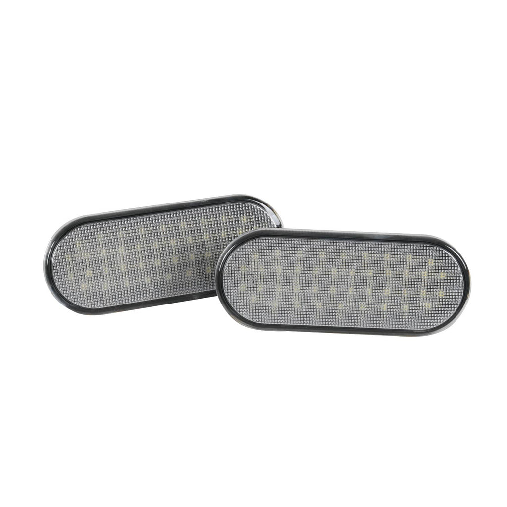 Pair of oval LED light housings with clear lens panels and black trim borders