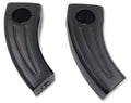 Black handlebar riser block pair with circular opening and sculpted grip channel